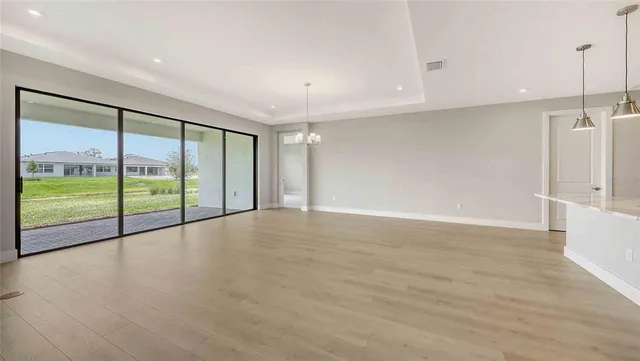 a view of an empty room with a sliding door
