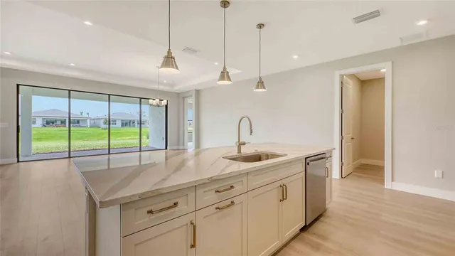 a kitchen with sink and window