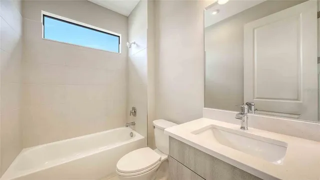 a bathroom with a sink a toilet and a bathtub