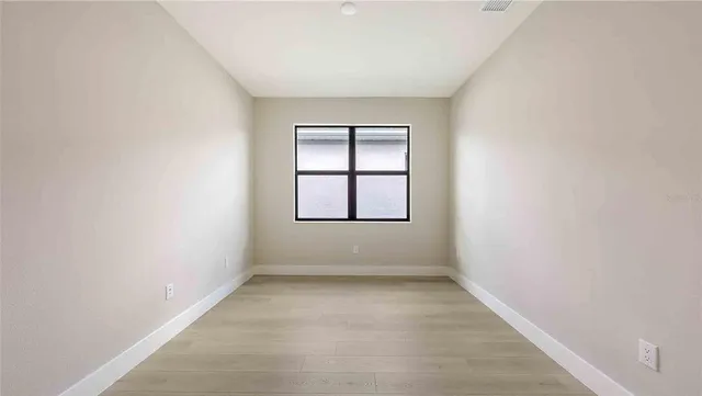 an empty room with windows