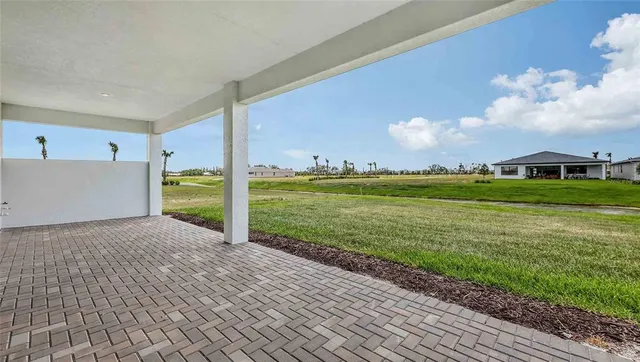 a view of a big room with a big yard and potted plants