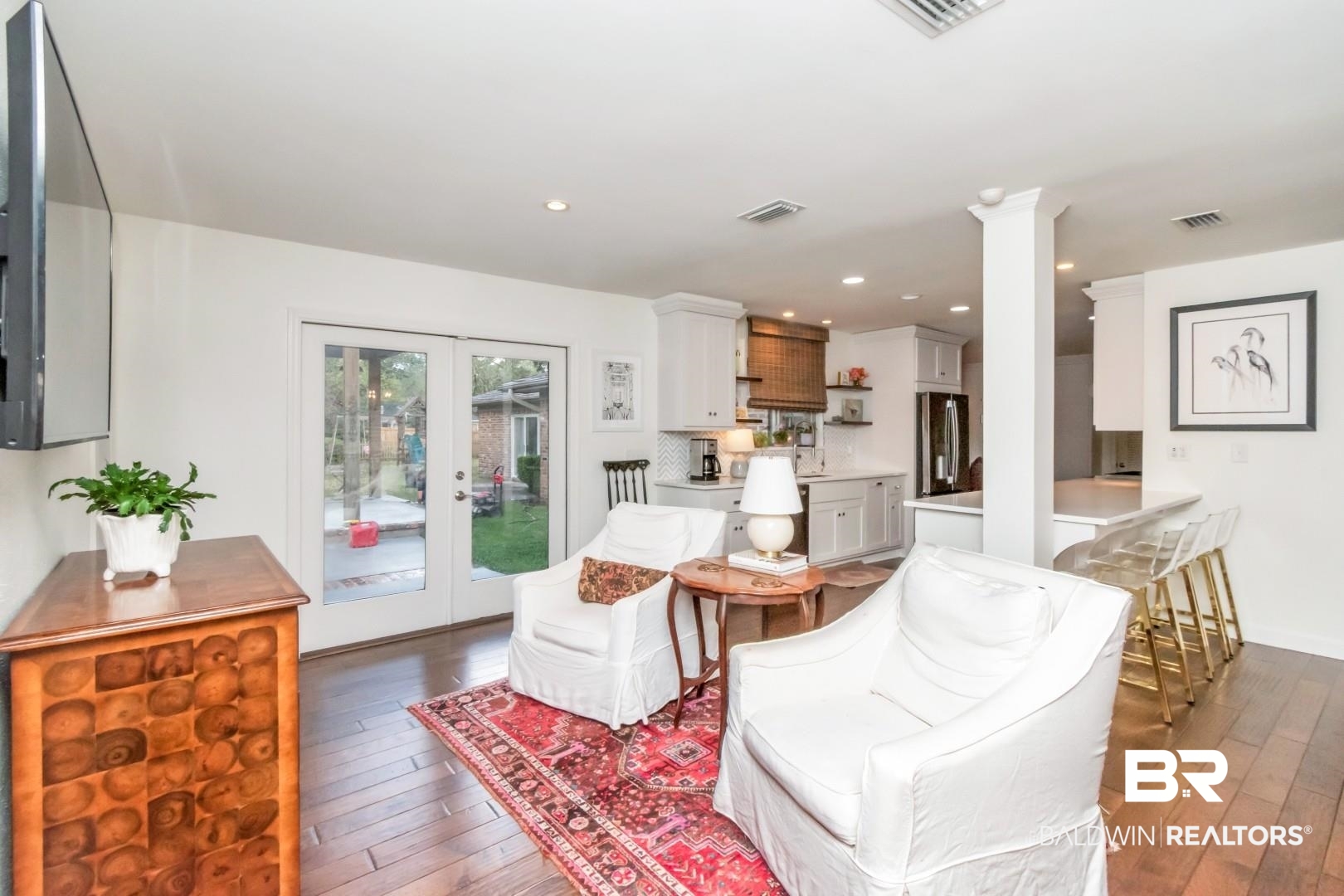 154 Fenwick Road Mobile, AL 36608 - Photo 11 of 48 Living room featuring french doors, dark wood-style floors, and recessed lighting