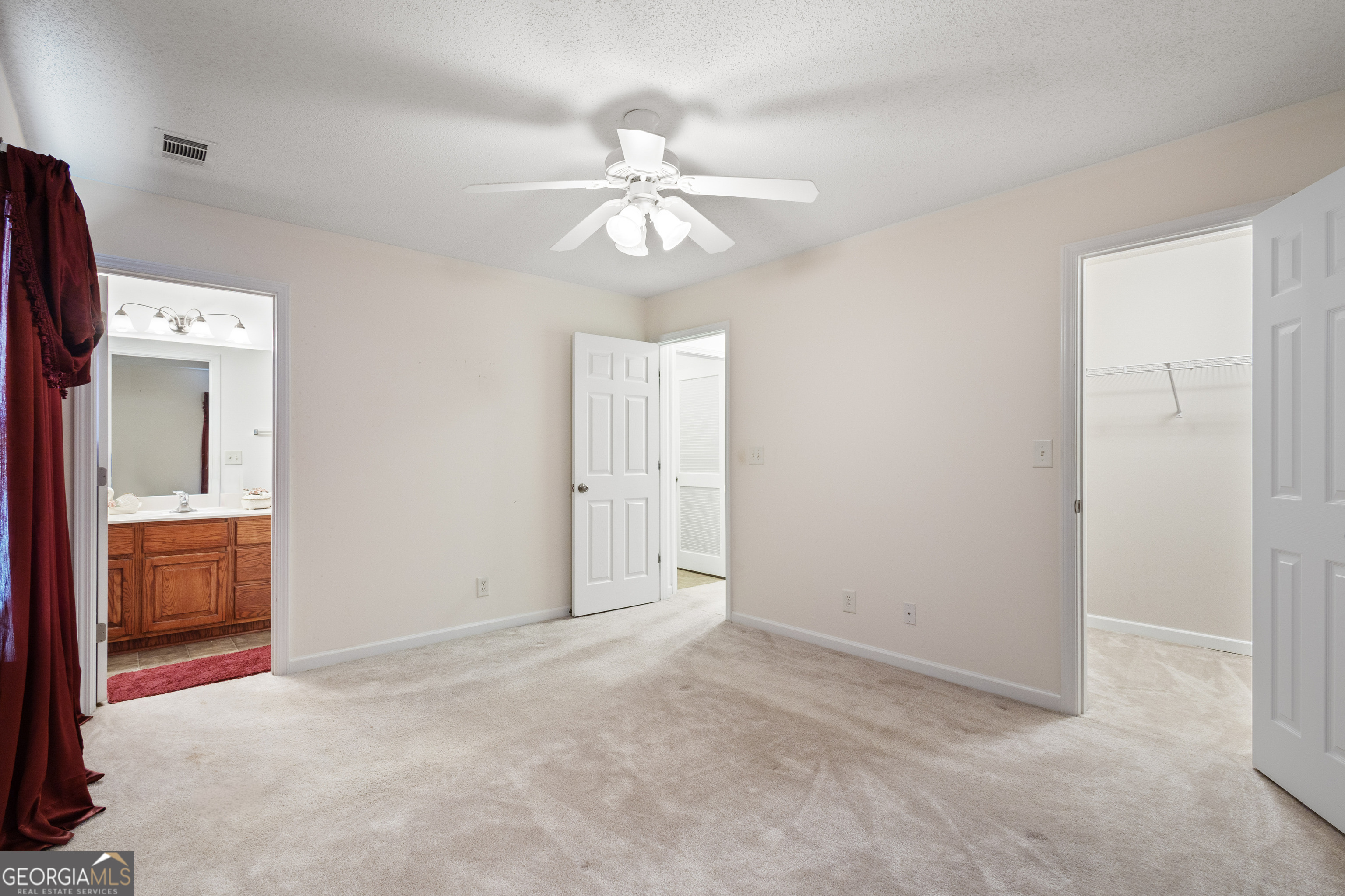 1275 Ross St Lane Macon, GA 31201 - Photo 11 of 20 an empty room with closet and a chandelier fan