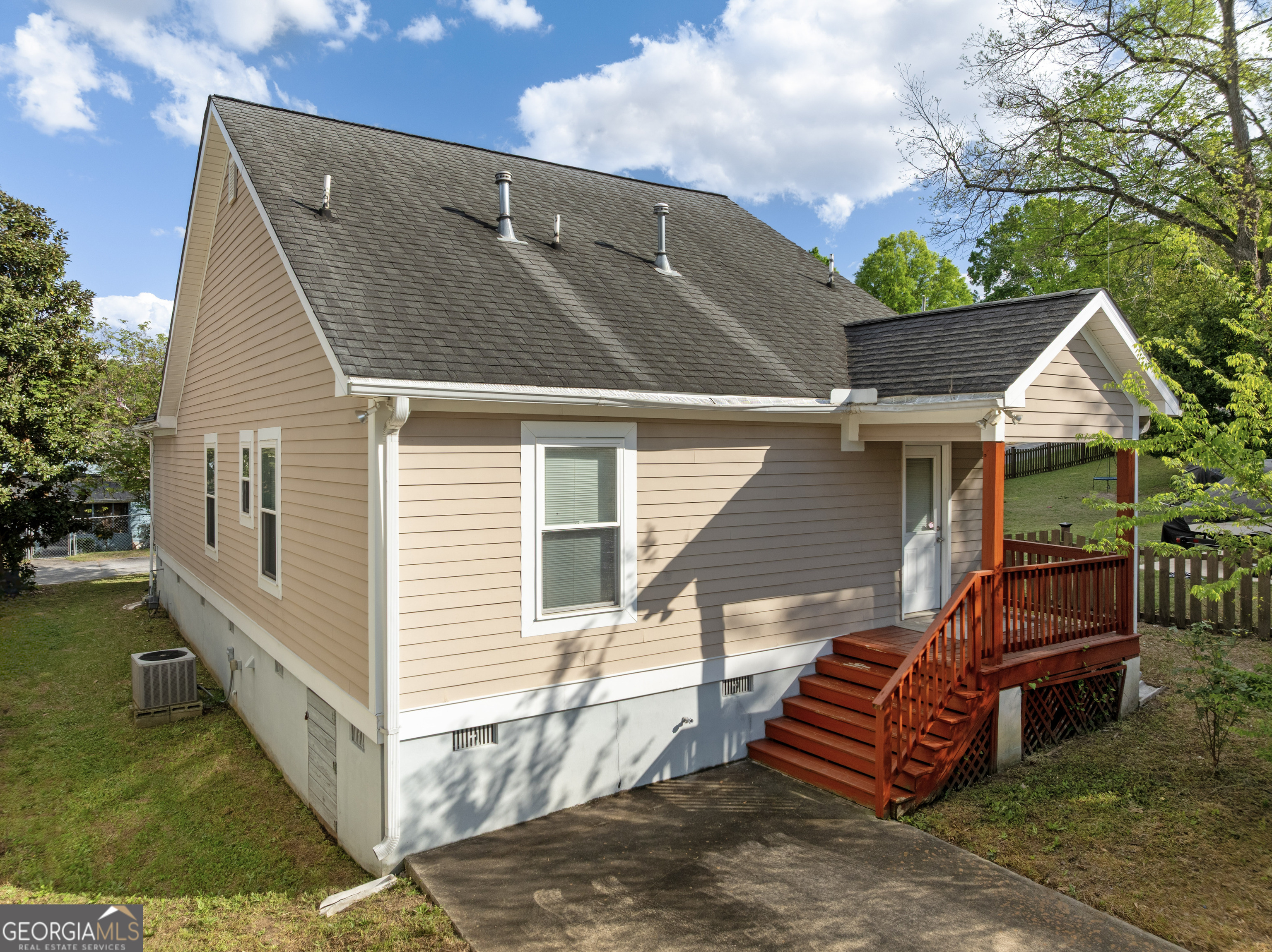 1275 Ross St Lane Macon, GA 31201 - Photo 18 of 20 a backyard of a house with barbeque oven table and chairs