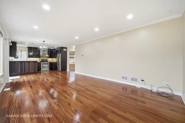 a view of kitchen with cabinets and wooden floor