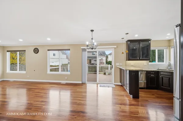 a bathroom with a granite countertop sink mirror vanity and toilet