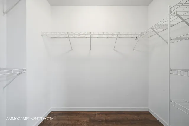 a living room with furniture and a entryway