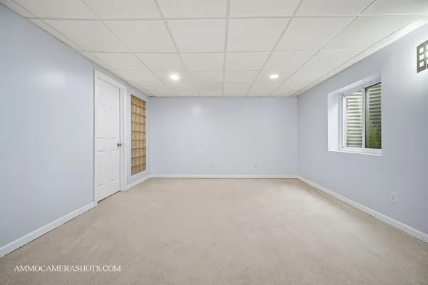 a view of a livingroom with furniture and a window