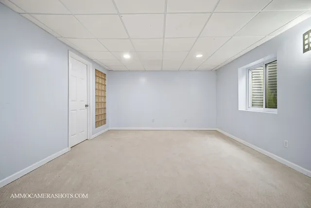 a view of a livingroom with furniture and a window