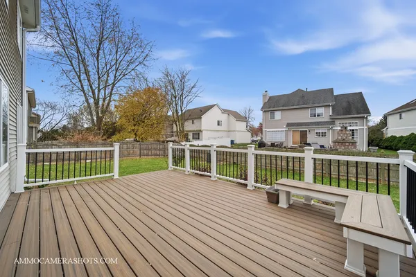 a view of a house with wooden deck