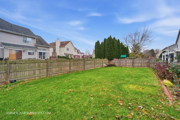 a front view of house with yard and seating area
