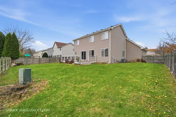 a view of a yard in front of a house with plants