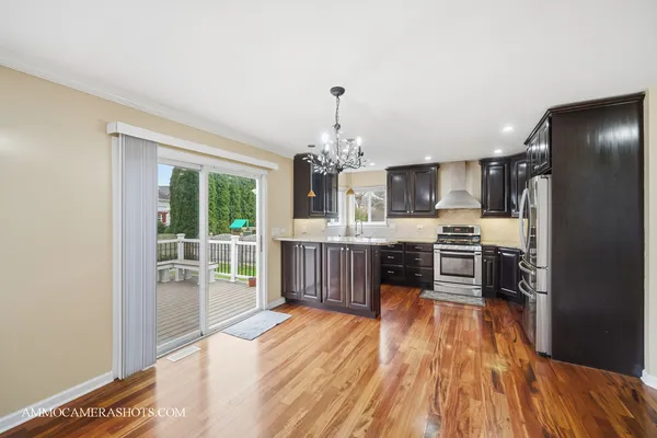 a dining room with furniture and wooden floor