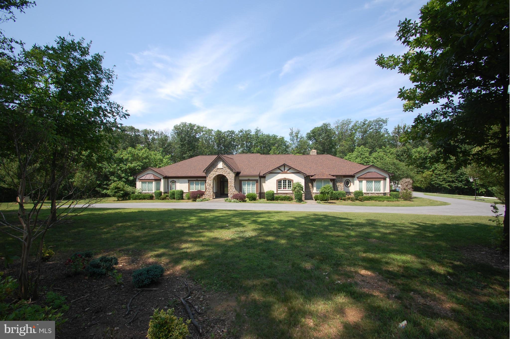 3840 Hooper Road New Windsor, MD 21776 - Photo 2 of 30 a front view of a house with a yard