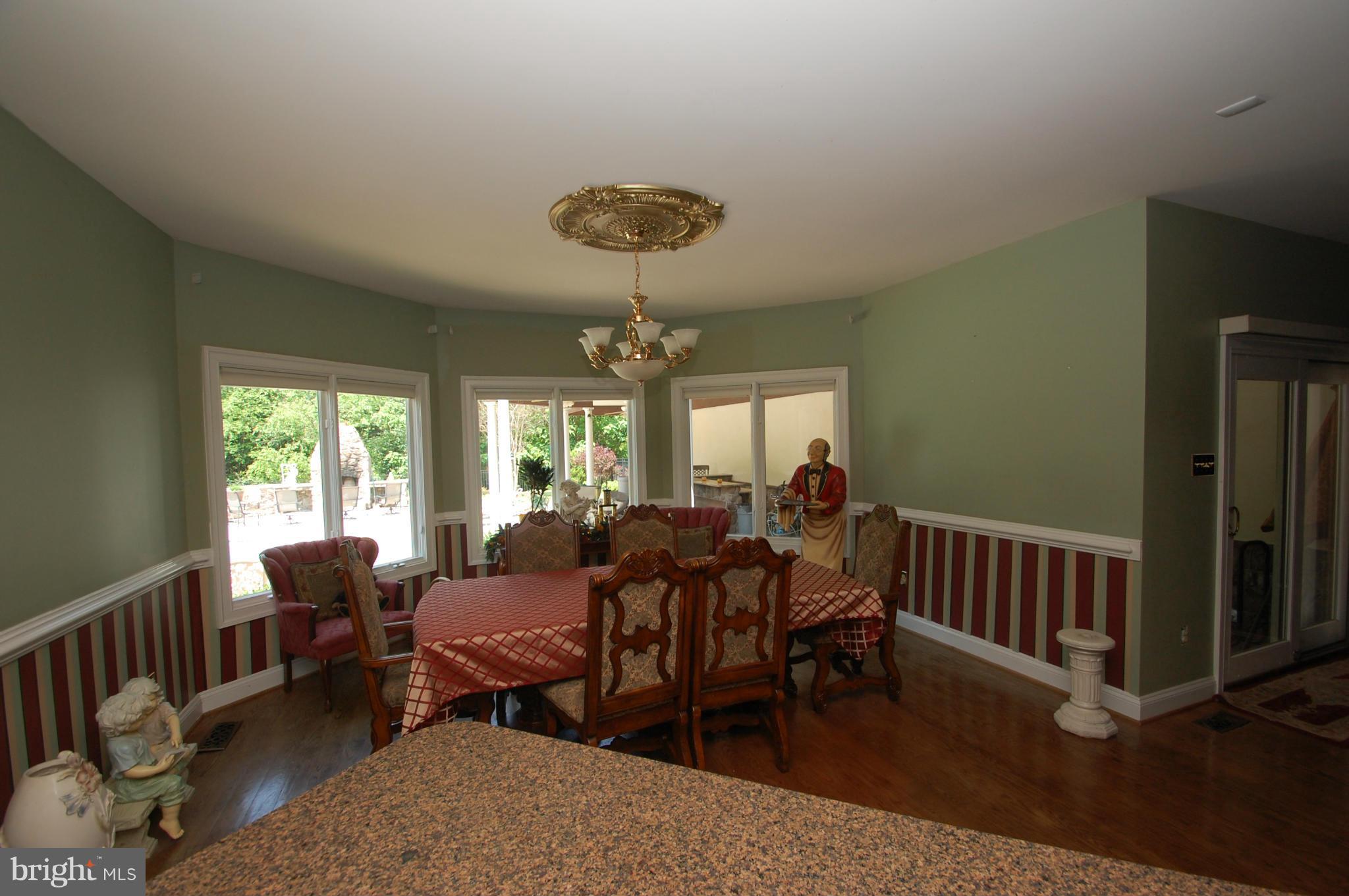 3840 Hooper Road New Windsor, MD 21776 - Photo 18 of 30 a view of a dining room with furniture window and outside view