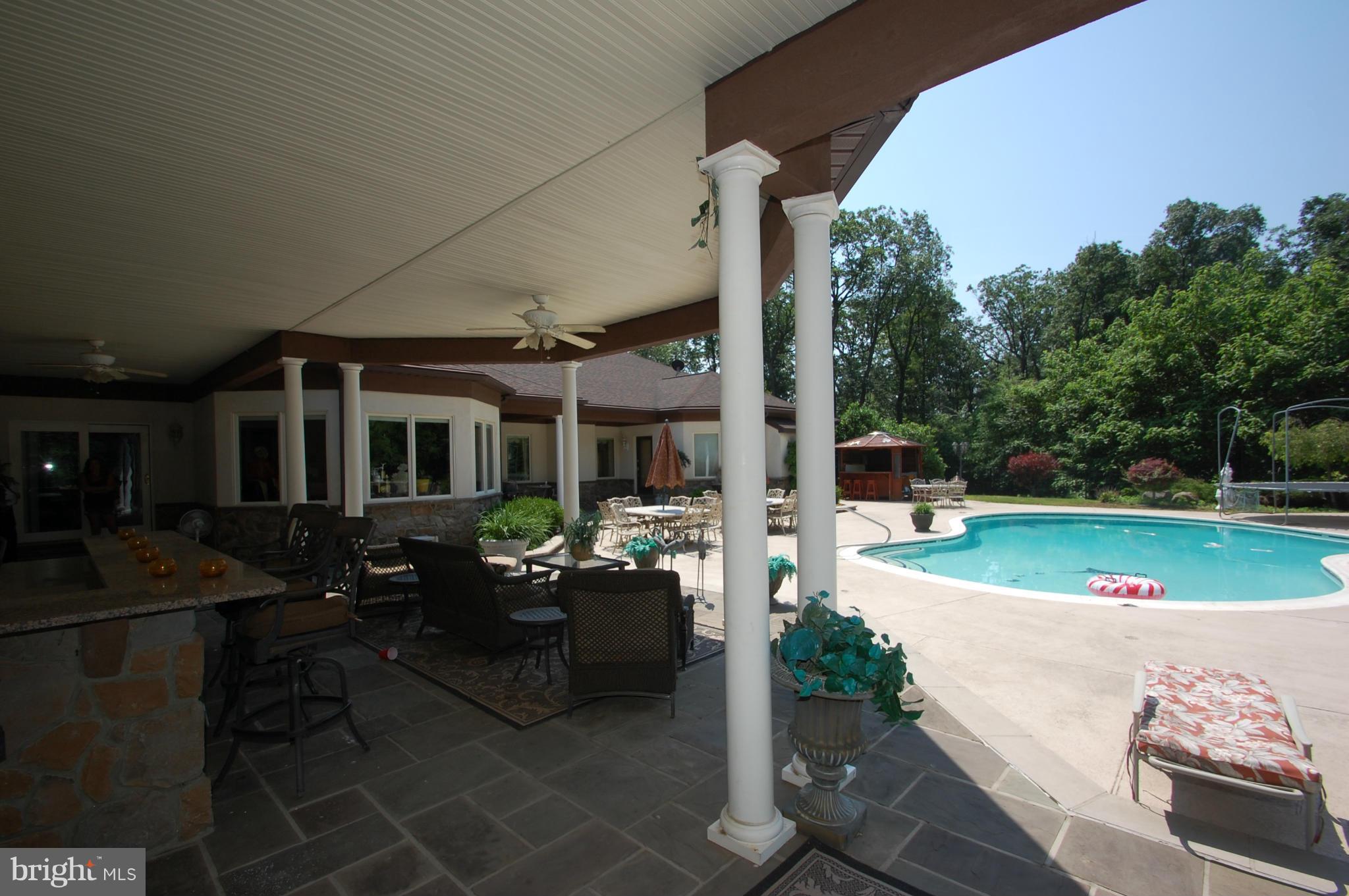3840 Hooper Road New Windsor, MD 21776 - Photo 28 of 30 a patio with table and chairs