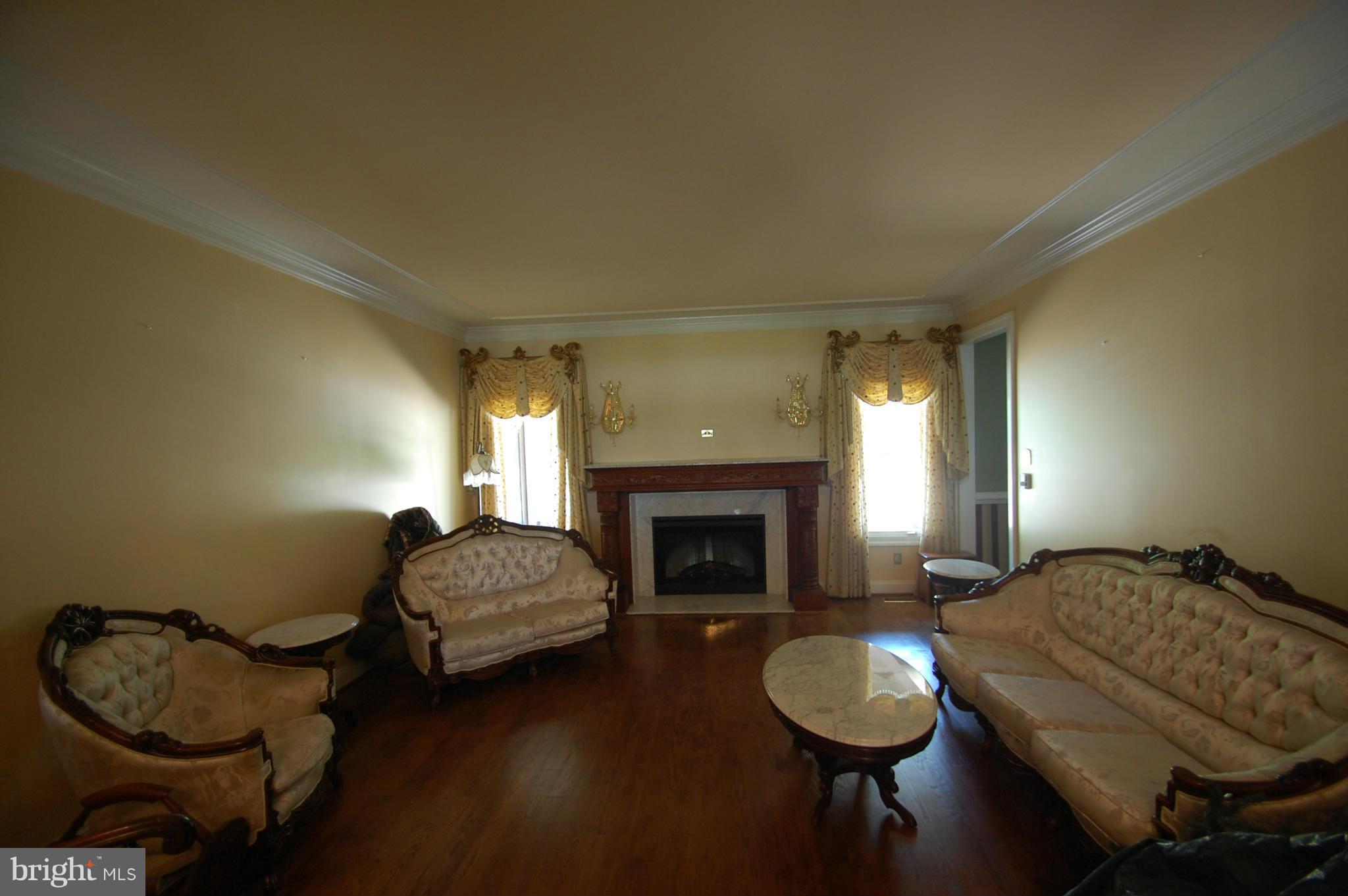 3840 Hooper Road New Windsor, MD 21776 - Photo 5 of 30 a living room with furniture and a fireplace