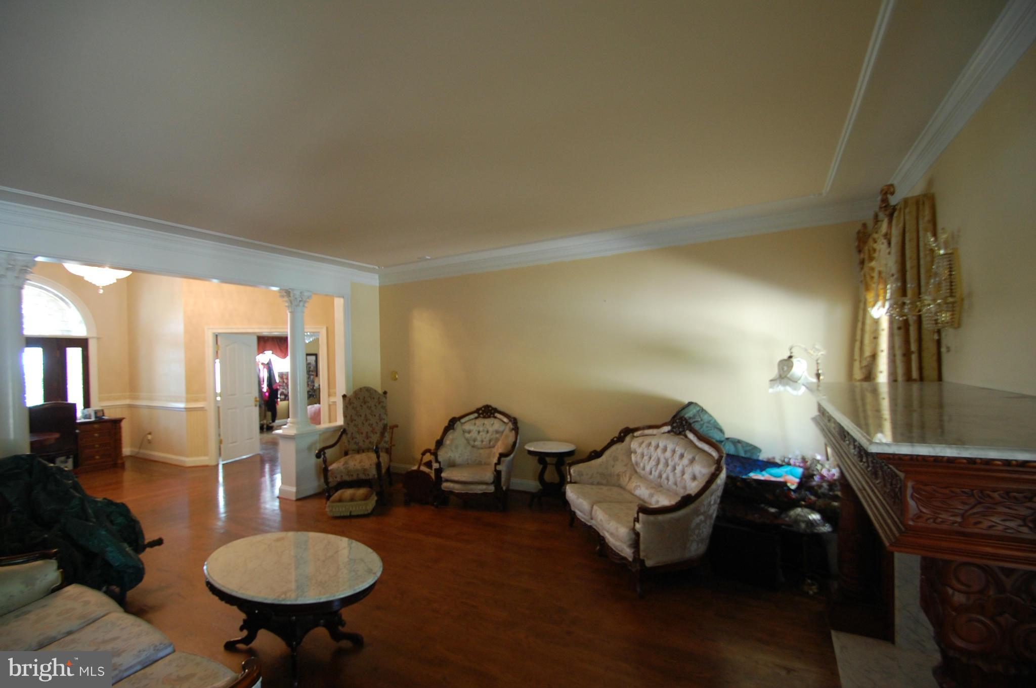 3840 Hooper Road New Windsor, MD 21776 - Photo 6 of 30 a living room with furniture and a gym