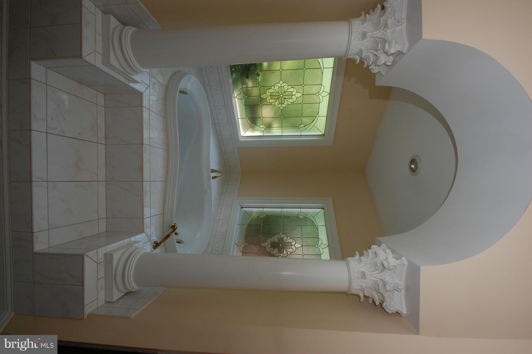 3840 Hooper Road New Windsor, MD 21776 - Photo 9 of 30 a bathroom with a tub and shower