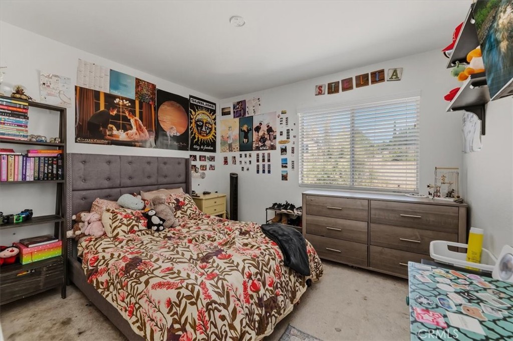 352 Leafwood Court Riverside, CA 92506 - Photo 25 of 42 a bedroom with a bed and cabinets