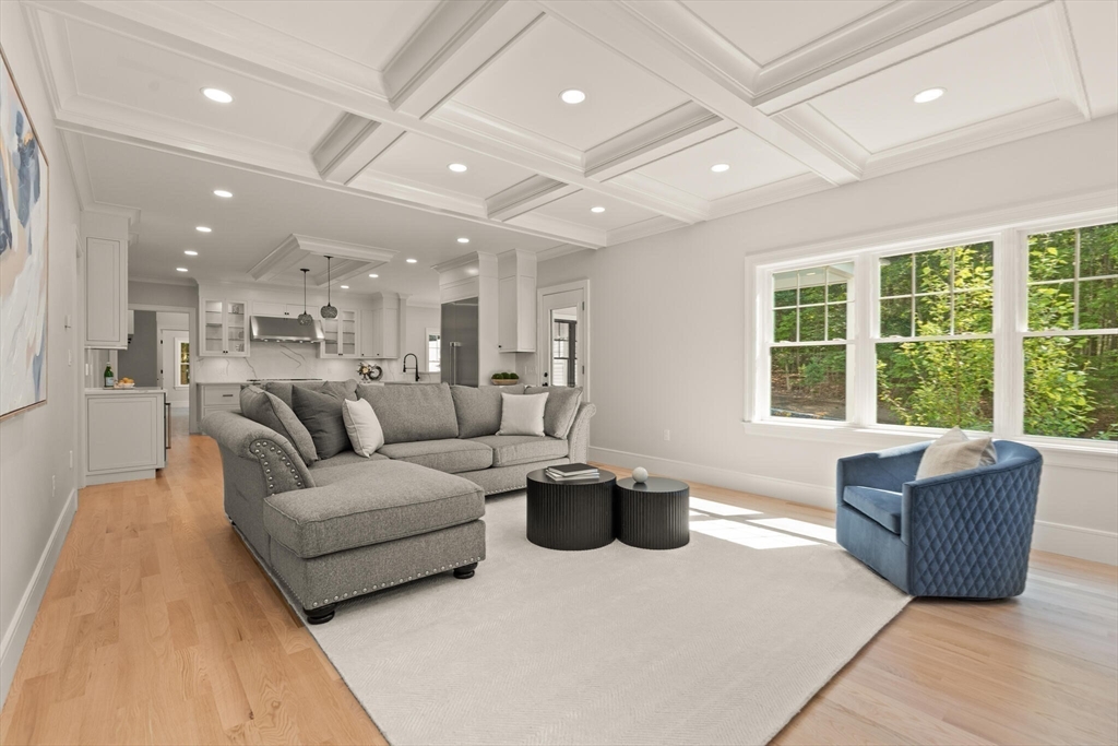 21 Columbus Street Lexington, MA 02421 - Photo 11 of 42 a living room with furniture and a large window