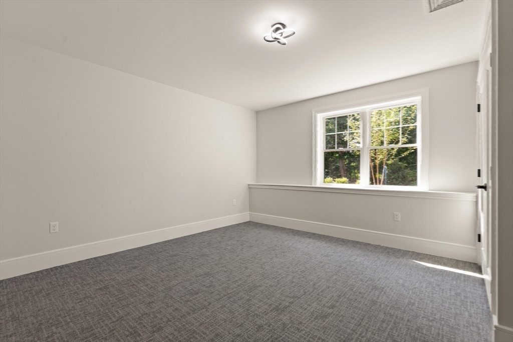 21 Columbus Street Lexington, MA 02421 - Photo 36 of 42 an empty room with a window