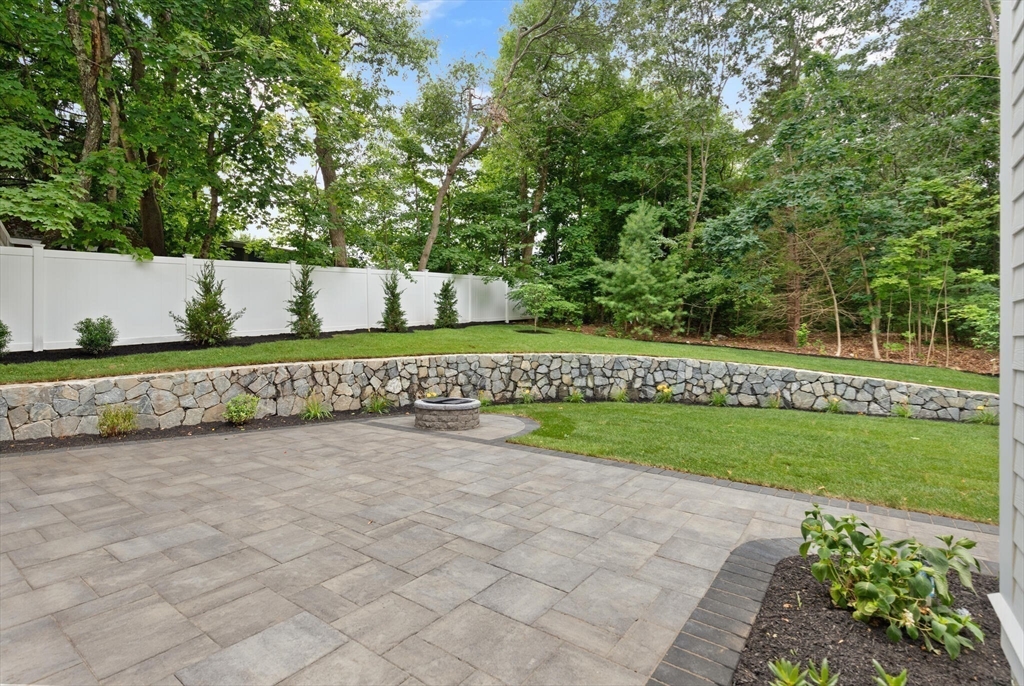 21 Columbus Street Lexington, MA 02421 - Photo 39 of 42 a view of a park with a bench and trees