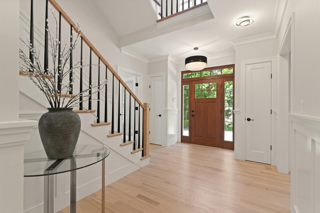 21 Columbus Street Lexington, MA 02421 - Photo 4 of 42 a view of an entryway with wooden floor