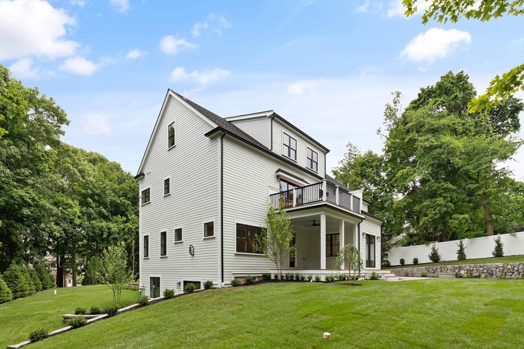 21 Columbus Street Lexington, MA 02421 - Photo 42 of 42 a front view of house with yard and green space