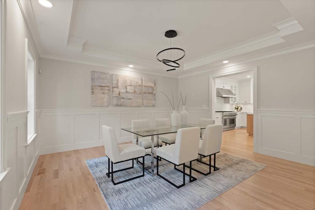 21 Columbus Street Lexington, MA 02421 - Photo 5 of 42 a view of a dining room with furniture and wooden floor