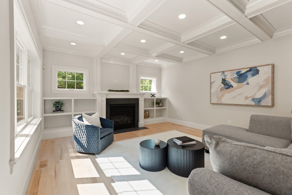 21 Columbus Street Lexington, MA 02421 - Photo 10 of 42 a living room with furniture and a fireplace