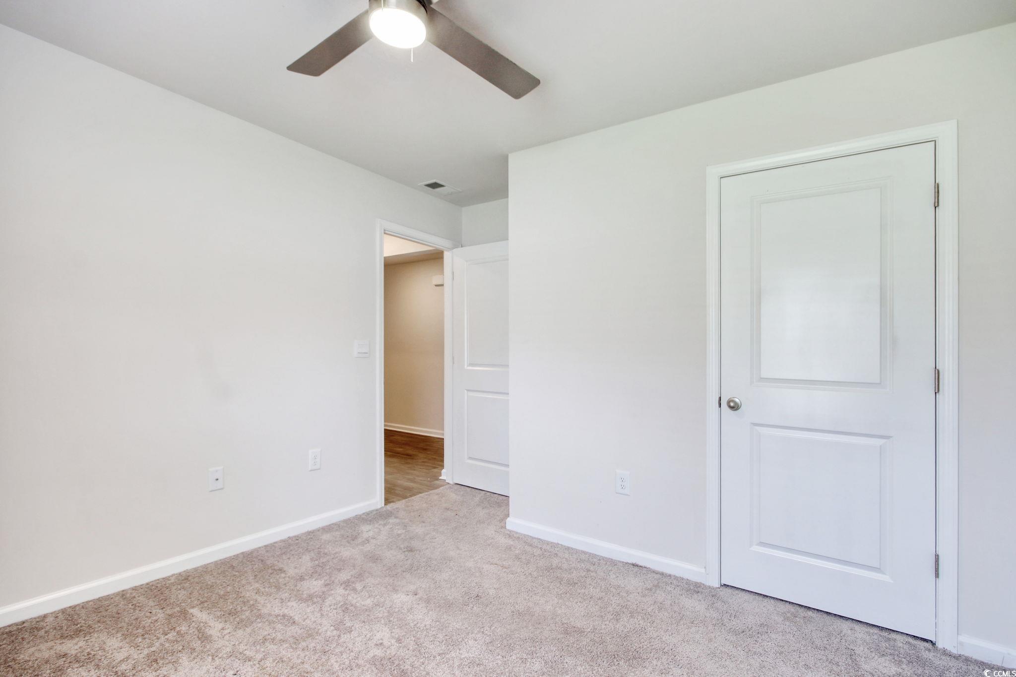 211 Seasons Trace Loop Longs, SC 29568 - Photo 28 of 37 Unfurnished bedroom with carpet flooring and ceiling fan