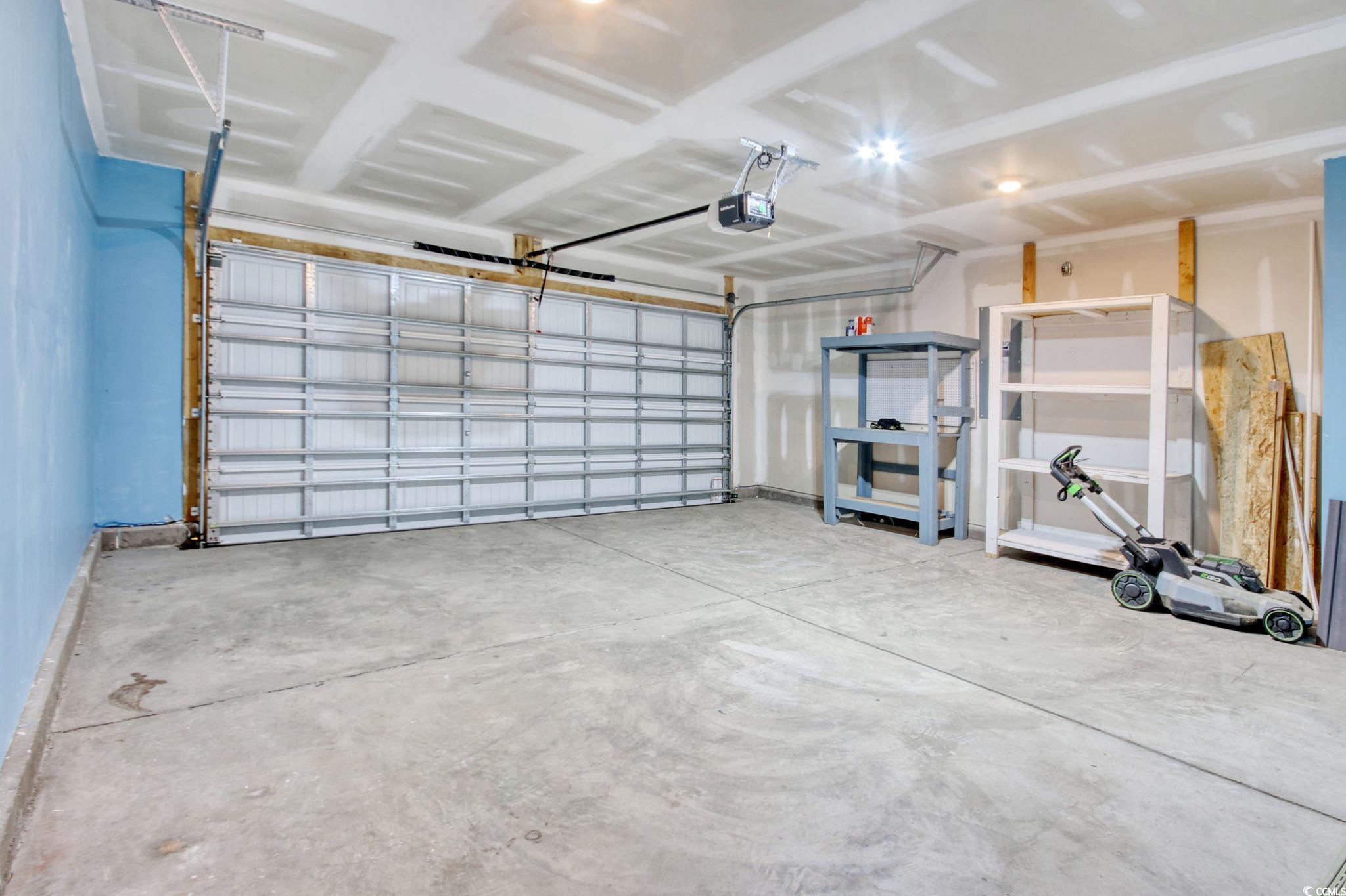 211 Seasons Trace Loop Longs, SC 29568 - Photo 34 of 37 Garage with a garage door opener