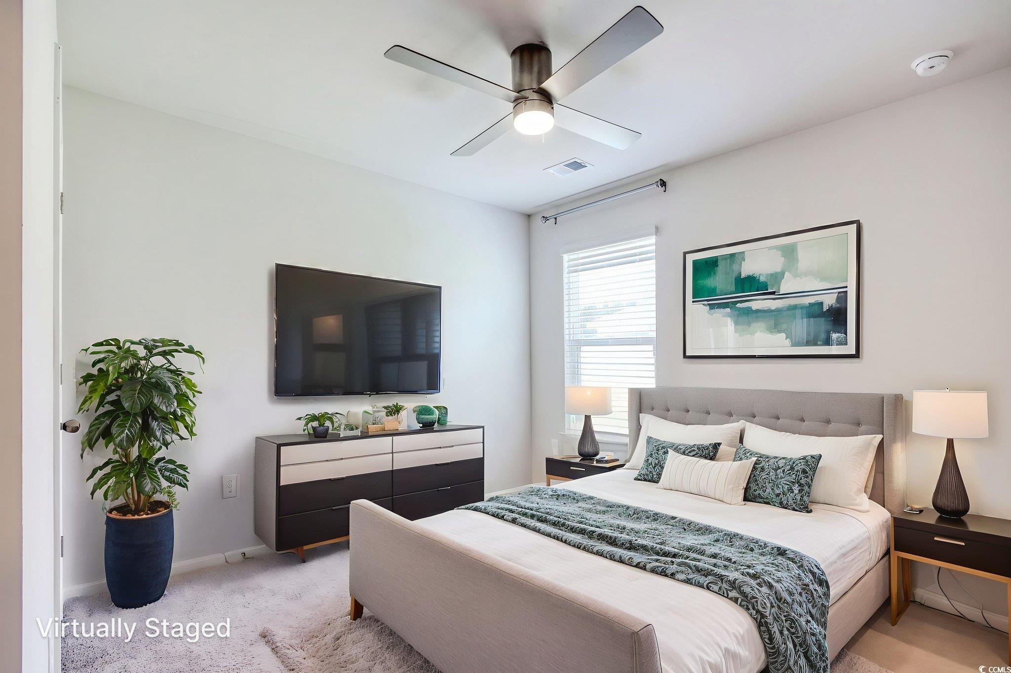 211 Seasons Trace Loop Longs, SC 29568 - Photo 5 of 37 Carpeted bedroom featuring a ceiling fan and baseboards