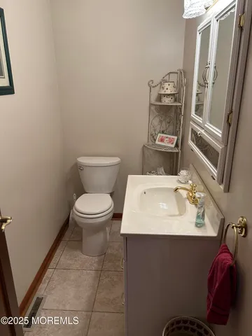 a bathroom with a sink toilet and vanity