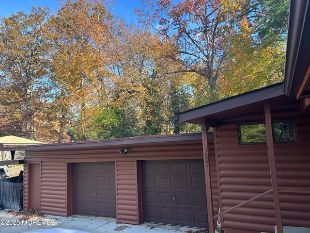 a view of a house with a tree