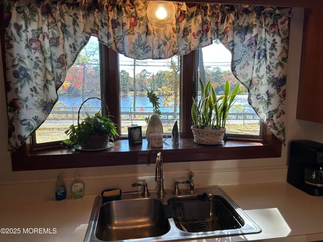 a kitchen with a sink and a window