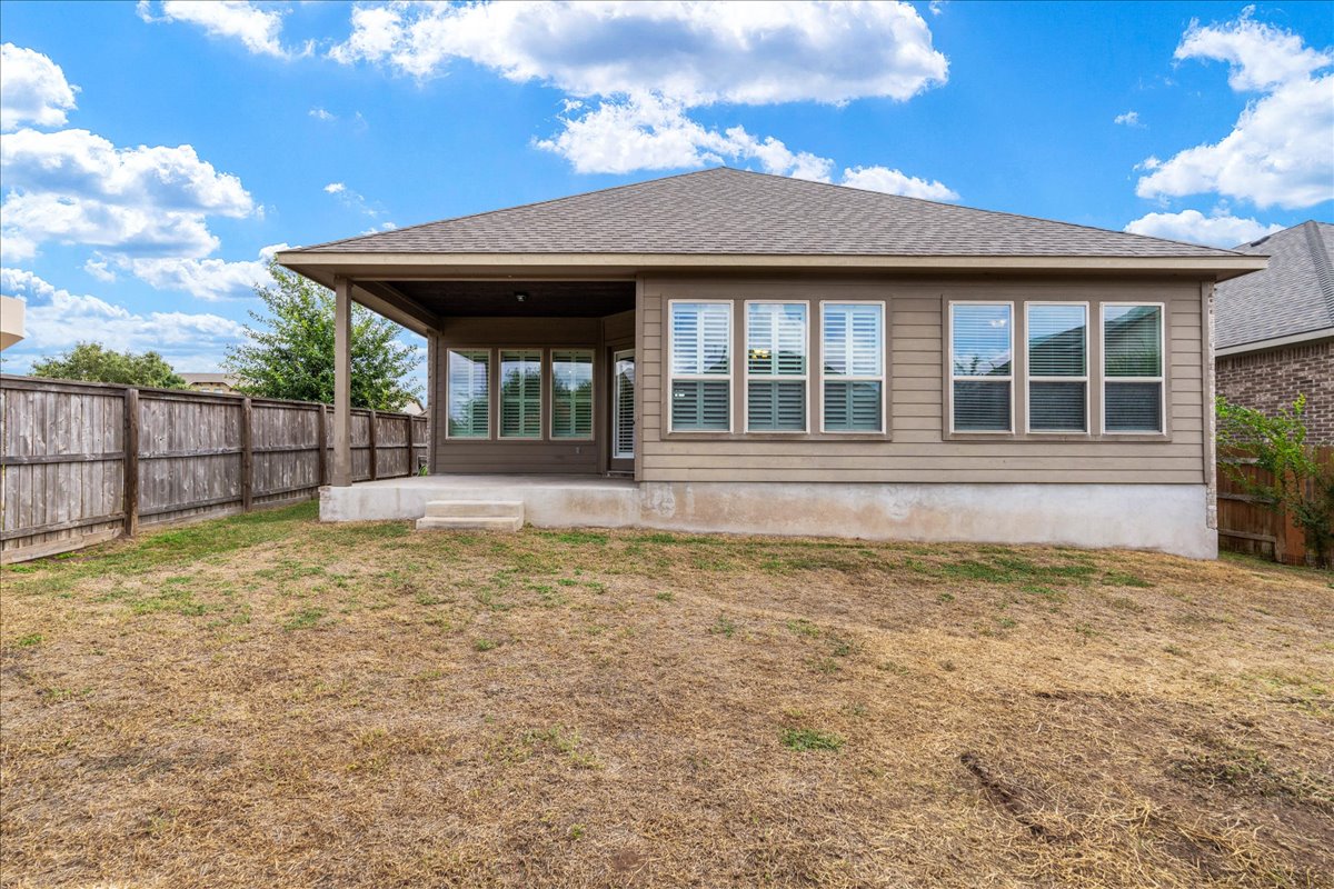 600 Garner Park Drive Georgetown, TX 78628 - Photo 30 of 39 Rear view of house featuring a patio area, a fenced backyard, and a shingled roof