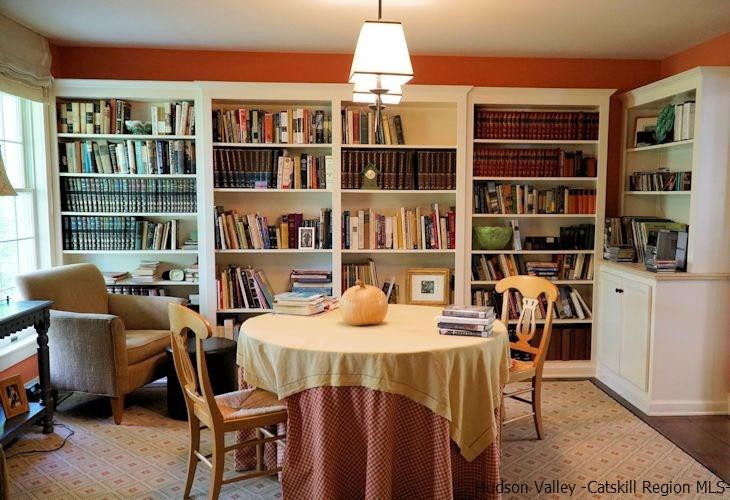 15 Hewlett Road Red Hook, NY 12571 - Photo 15 of 29 a work room with furniture windows and book shelf