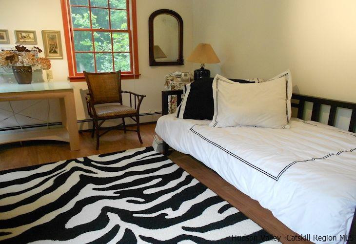 15 Hewlett Road Red Hook, NY 12571 - Photo 18 of 29 a bedroom with a bed and a large window