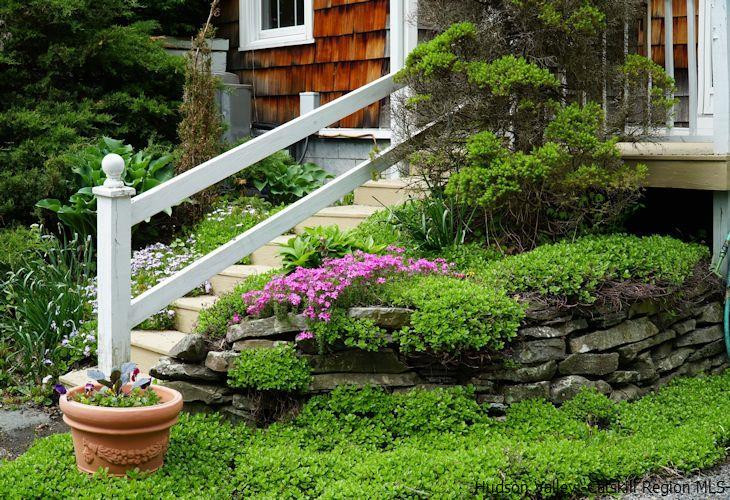 15 Hewlett Road Red Hook, NY 12571 - Photo 25 of 29 a view of a backyard with plants and a fountain