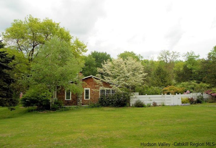 15 Hewlett Road Red Hook, NY 12571 - Photo 29 of 29 a front view of a house with a garden