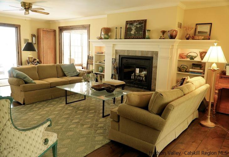 15 Hewlett Road Red Hook, NY 12571 - Photo 7 of 29 a living room with furniture and a fireplace