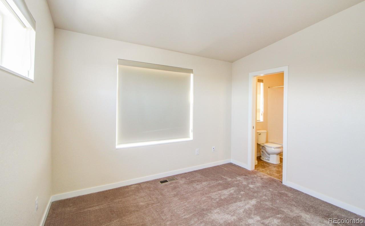 10122 Belvedere Loop Lone Tree, CO 80124 - Photo 13 of 17 an empty room with windows