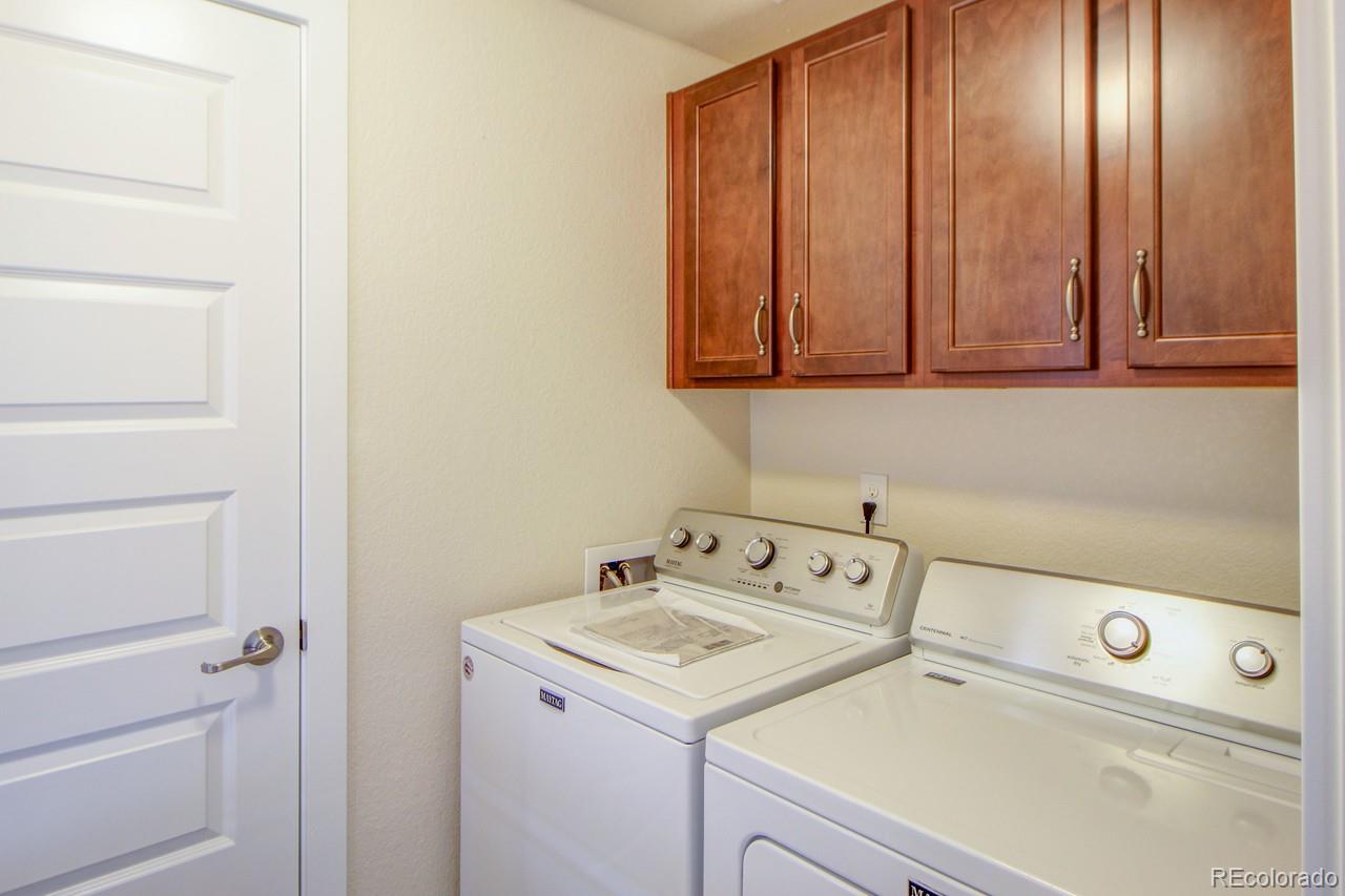 10122 Belvedere Loop Lone Tree, CO 80124 - Photo 15 of 17 a utility room with dryer and washer