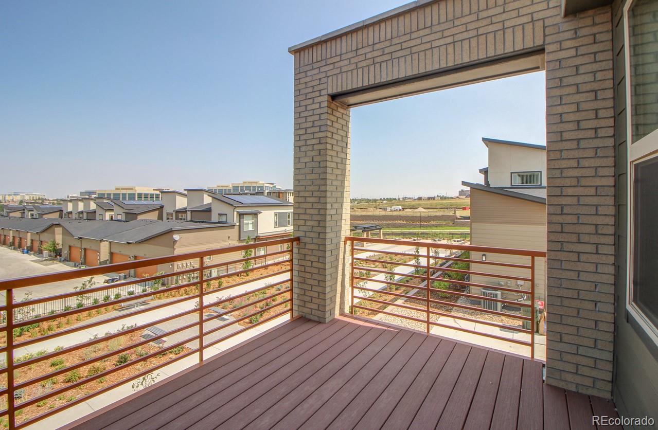 10122 Belvedere Loop Lone Tree, CO 80124 - Photo 16 of 17 a view of a balcony with wooden floor