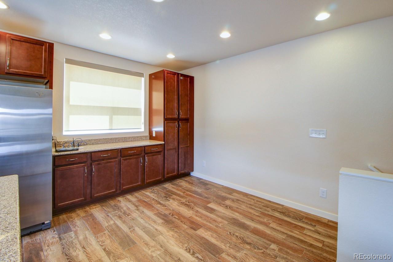 10122 Belvedere Loop Lone Tree, CO 80124 - Photo 5 of 17 a room with a bed and a dresser