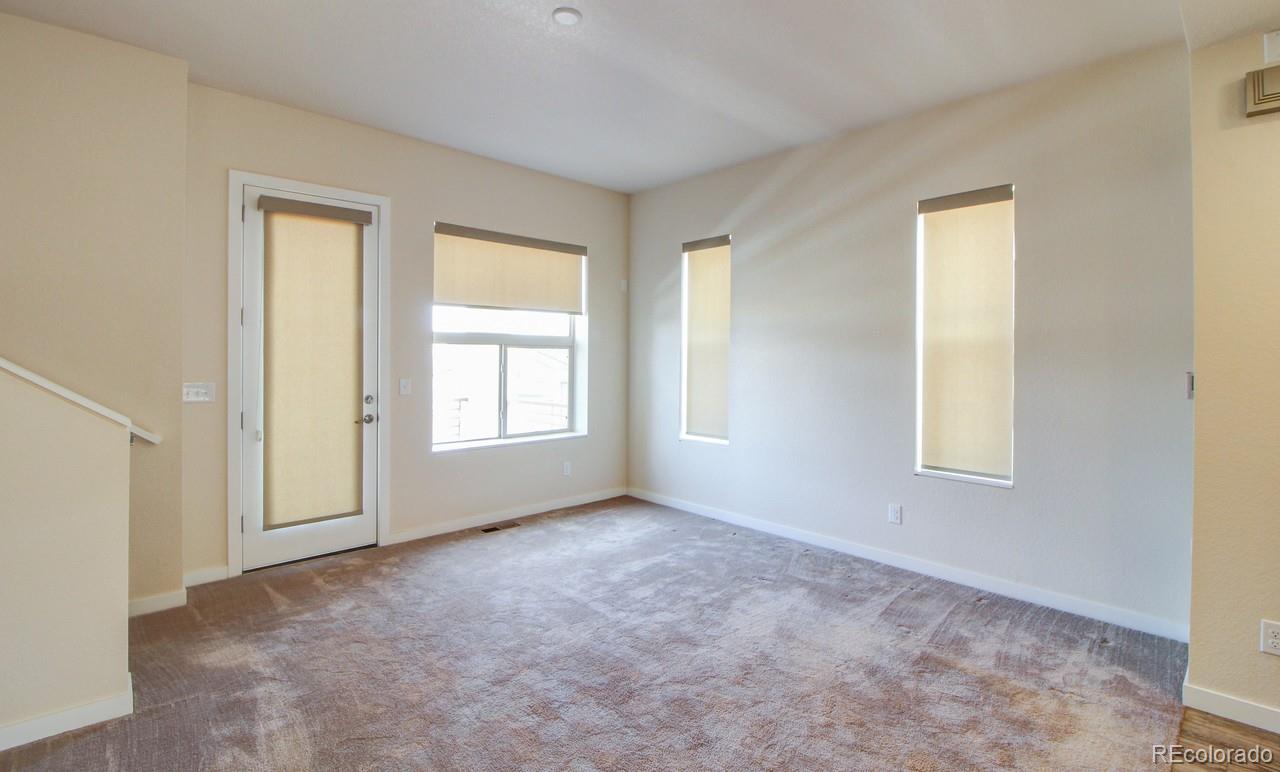 10122 Belvedere Loop Lone Tree, CO 80124 - Photo 7 of 17 a view of an empty room with window