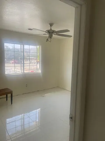 a bathroom with a glass door shower and a sink