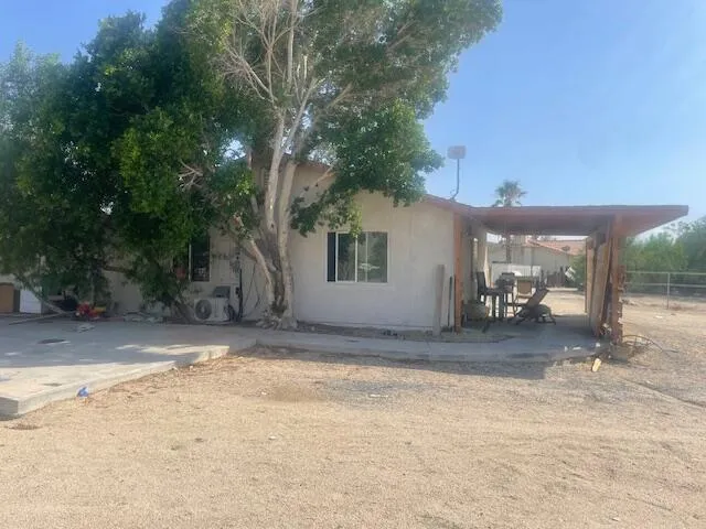 a view of kitchen with refrigerator and chair